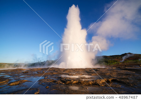 Strokkur geyser eruption in Iceland 48967487