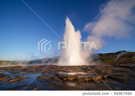 Eruption of the Geysir geyser in Iceland 48967488