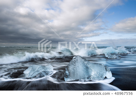 Ice on the beach with black sand in Iceland 48967556