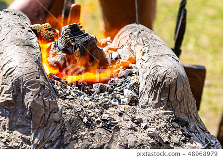 burning coal orange flame street melting 48968979