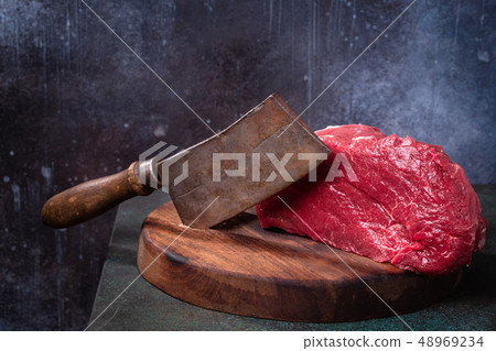 Raw beef and meat cleaver  48969234