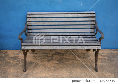 Wooden chair in the park Wooden chair in the park 48972749