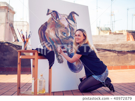 Young woman paint artist drawing at home roof Young woman paint artist drawing at home roof 48972879