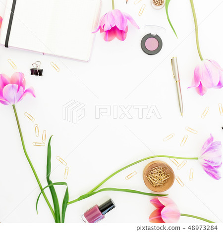 Concept with clipboard, notebook, pen, pink tulip Concept with clipboard, notebook, pen, pink tulip 48973284