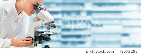 Scientist researcher uses microscope in laboratory 48973285
