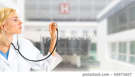 Woman doctor working at the hospital office. Woman doctor working at the hospital office. 48973607