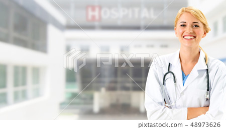 Woman doctor working at the hospital office. 48973626