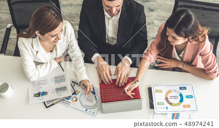 Businessman and businesswomen working in office. Businessman and businesswomen working in office. 48974241