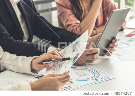 Businessman and businesswomen working in office. Businessman and businesswomen working in office. 48974297
