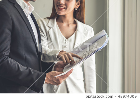 Businesswoman meeting with businessman in office. Businesswoman meeting with businessman in office. 48974309