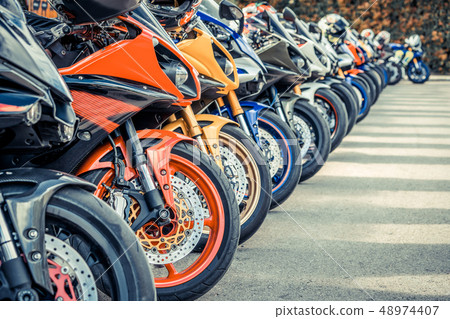 Motorcycles group parking on city street in summer 48974407