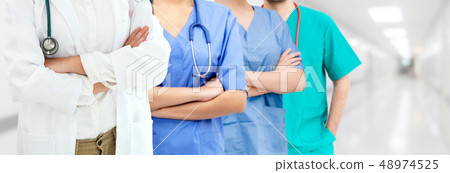 Doctor working in hospital with other doctors. Doctor working in hospital with other doctors. 48974525