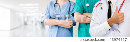 Doctor working in hospital with other doctors. 48974557