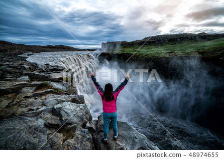 Traveler Travels to Dettifoss Waterfall in Iceland Traveler Travels to Dettifoss Waterfall in Iceland 48974655