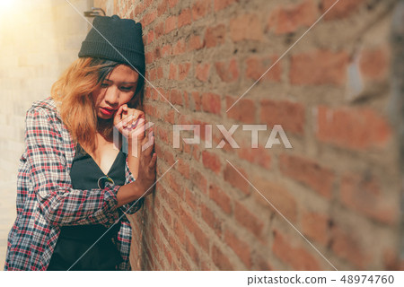 Depressed teenage woman feeling sad and lonely. 48974760