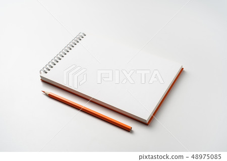 perspective view of spiral orange notebook perspective view of spiral orange notebook 48975085