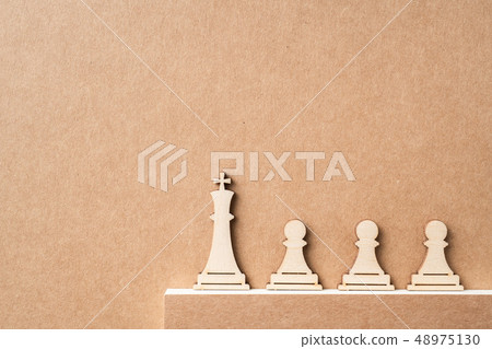 wooden chess on kraft paper with mistake concept wooden chess on kraft paper with mistake concept 48975130