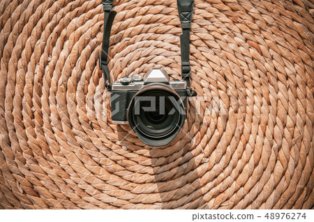 Old vintage retro style camera on dried water Old vintage retro style camera on dried water 48976274