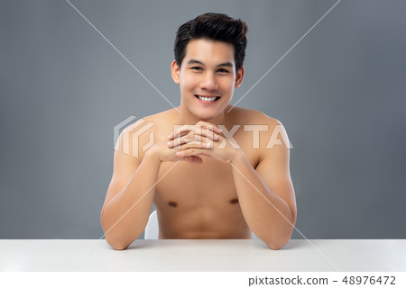 Portrait of shirtless handsome smiling young Asian 48976472