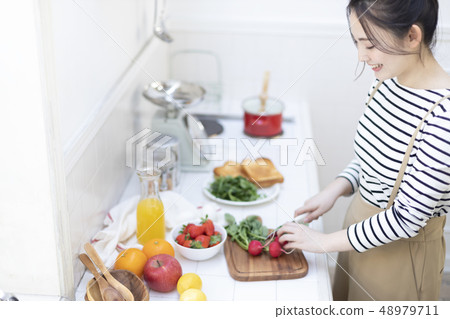Woman kitchen cooking 48979711
