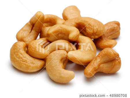 Roasted cashew nuts isolated on white Roasted cashew nuts isolated on white 48980708