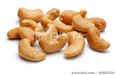 Roasted cashew nuts isolated on white Roasted cashew nuts isolated on white 48980709