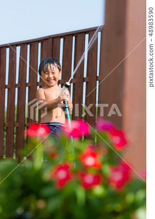 Garden lawn boy water play Garden lawn boy water play 48983590