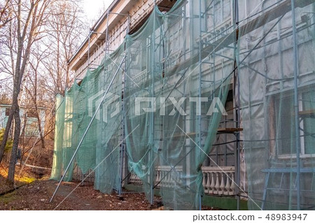 Construction site restoration work on the renovation of the old facade of the building Construction site restoration work on the renovation of the old facade of the building 48983947