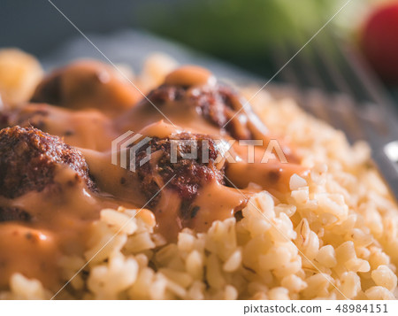 Bulgur and meatball in plate 48984151