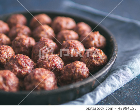 Homemade beef meatballs in cast-iron skillet Homemade beef meatballs in cast-iron skillet 48984153