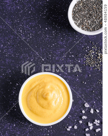 Vegan creamy cheddar cheese sauce with chia seeds 48984159