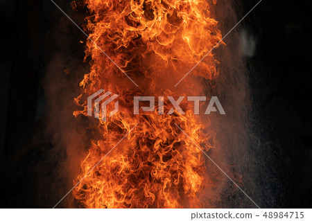 Closeup Fire flames from gas explosion on black Closeup Fire flames from gas explosion on black 48984715