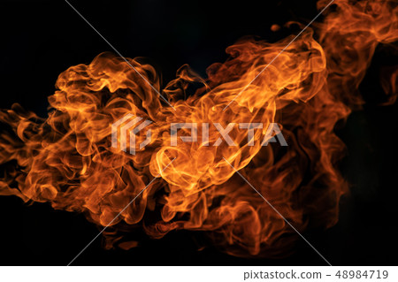 Closeup Fire flames from gas explosion on black Closeup Fire flames from gas explosion on black 48984719
