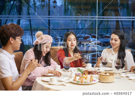 Young people eating out Young people eating out 48984917