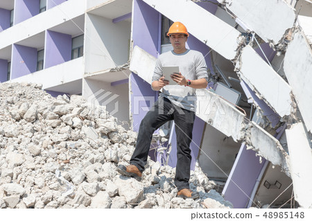 Engineer architect and worker operation control demolish old building. Engineer architect and worker operation control demolish old building. 48985148