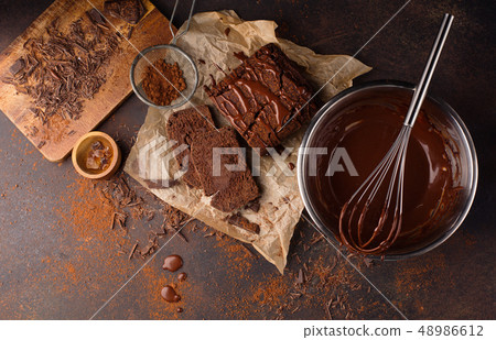 Homemade chocolate cake and cream with whisk 48986612