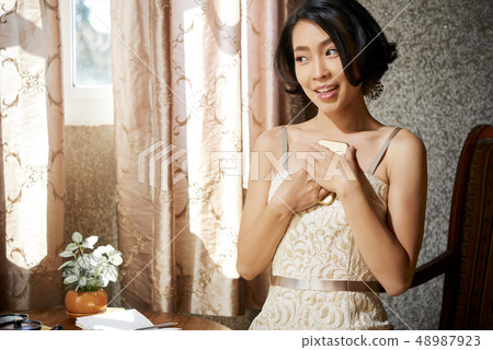 Cheerful yuong woman 48987923