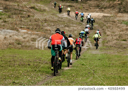 group of male cyclists group of male cyclists 48988499