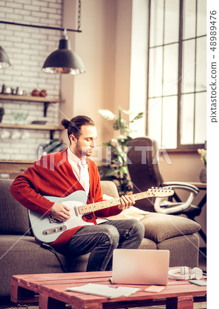 Talented musician having inspiration composing new melody 48989476