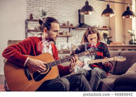 Two Friends Feeling Joyful Playing The Guitars Stock Photo 48989842 Pixta