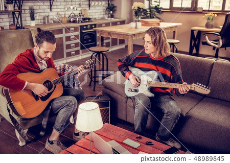 Musicians wearing jeans composing new melody for the song 48989845