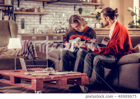 Rock players having rehearsal at home before performing Rock players having rehearsal at home before performing 48989875