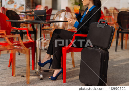 Female business traveler in cafe 48990321