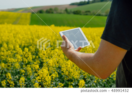 Agriculture Farmer holding tablet Agriculture Farmer holding tablet 48991432