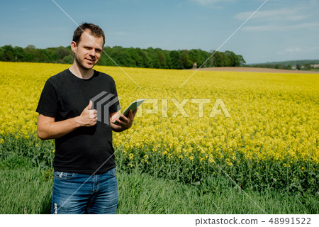 Agriculture Farmer holding tablet Agriculture Farmer holding tablet 48991522