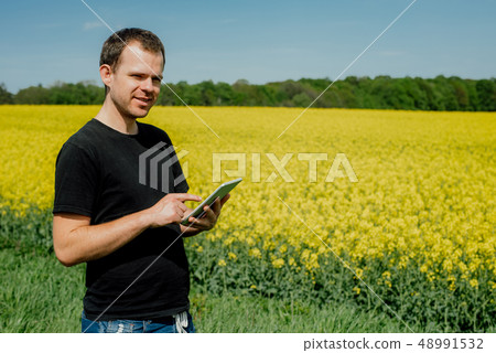 Agriculture Farmer holding tablet Agriculture Farmer holding tablet 48991532