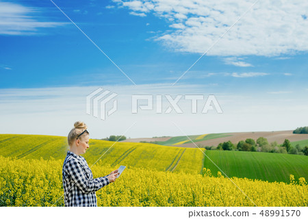 Agriculture Farmer Using Digital Tablet Examining Crops Agriculture Farmer Using Digital Tablet Examining Crops 48991570