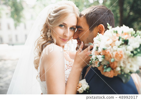 Luxury married wedding couple, bride and groom posing in old city 48992017