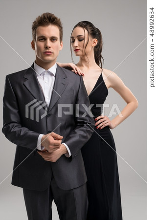 Sexy young couple in eveing clothes shot - Stock Photo [48992634]
