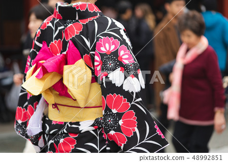 Young girl wearing Japanese kimono standing in Young girl wearing Japanese kimono standing in 48992851